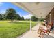 Inviting porch with rocking chairs, offering a relaxing space to enjoy the beautiful landscape at 3451 Greene Rd, Monroe, NC 28110
