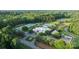 Stunning aerial view of a community with tennis courts, a pool, clubhouse, and lush greenery at 347 Bayberry Creek Cir, Mooresville, NC 28117