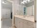Bathroom featuring a light colored vanity and a view into another room with an arcade game at 347 Bayberry Creek Cir, Mooresville, NC 28117