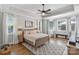 Bright and airy main bedroom features tray ceiling, large windows, and a neutral color palette at 347 Bayberry Creek Cir, Mooresville, NC 28117