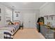 bedroom showcasing a single bed, double doors, and an arcade game at 347 Bayberry Creek Cir, Mooresville, NC 28117