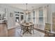 Cozy breakfast nook with wood table, lots of natural light, and access to the outdoor deck at 347 Bayberry Creek Cir, Mooresville, NC 28117