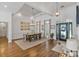 Open dining room with hardwood floors, modern chandelier, and an elegant decor at 347 Bayberry Creek Cir, Mooresville, NC 28117