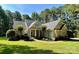 Charming single-Gathering home with manicured lawn, lush landscaping, and inviting covered entryway at 347 Bayberry Creek Cir, Mooresville, NC 28117