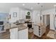 Open-concept kitchen features granite counters, a center island, stainless appliances, and ample cabinet space at 347 Bayberry Creek Cir, Mooresville, NC 28117