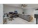Living room featuring a large gray couch, desk area, and an arcade game at 347 Bayberry Creek Cir, Mooresville, NC 28117