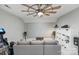 Living room with a projector screen, speakers, ceiling fan and comfortable gray seating at 347 Bayberry Creek Cir, Mooresville, NC 28117