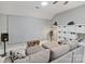 Living room with projector screen, speakers, ceiling fan and comfortable gray seating at 347 Bayberry Creek Cir, Mooresville, NC 28117