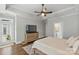 Spacious main bedroom with hardwood floors, tv, and ensuite bathroom at 347 Bayberry Creek Cir, Mooresville, NC 28117