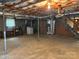Spacious unfinished basement with utility connections and access to upper floors at 356 Lucky Hollow Rd, Hickory, NC 28601