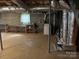 Spacious unfinished basement with utilities, storage shelving, and concrete flooring at 356 Lucky Hollow Rd, Hickory, NC 28601