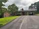 Charming brick home with a long driveway and covered carport at 356 Lucky Hollow Rd, Hickory, NC 28601