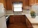 Functional kitchen with wooden cabinets and a stainless-steel sink at 356 Lucky Hollow Rd, Hickory, NC 28601
