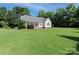 Expansive backyard with lush green grass and a lovely patio area at 3697 Travertine Dr, Lancaster, SC 29720