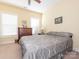 Comfortable bedroom with a ceiling fan, windows and carpeted flooring at 3697 Travertine Dr, Lancaster, SC 29720