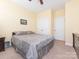 This bedroom offers ample closet space, a ceiling fan, and neutral walls at 3697 Travertine Dr, Lancaster, SC 29720