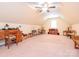 This bonus room offers natural light, a ceiling fan, and lots of space at 3697 Travertine Dr, Lancaster, SC 29720