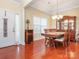 Elegant dining room featuring hardwood floors and a decorative chandelier at 3697 Travertine Dr, Lancaster, SC 29720