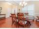 Lovely dining room with hardwood floors and a beautiful table setting at 3697 Travertine Dr, Lancaster, SC 29720