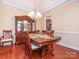 Formal dining room with hardwood flooring and large hutch at 3697 Travertine Dr, Lancaster, SC 29720