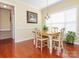 Charming dining area with hardwood floors, bright natural light, and stylish decor at 3697 Travertine Dr, Lancaster, SC 29720