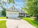 Inviting home exterior features a manicured lawn and a welcoming front porch at 3697 Travertine Dr, Lancaster, SC 29720