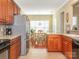 Open kitchen design with stainless steel appliances and a view into the dining area at 3697 Travertine Dr, Lancaster, SC 29720