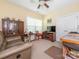 The living room has a ceiling fan, a couch, a window, and antique-style furnishings at 3697 Travertine Dr, Lancaster, SC 29720