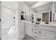 Modern bathroom featuring double sinks, tub-shower combo, and a black and white color scheme at 416 Balboa St, Matthews, NC 28104