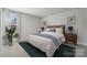 Cozy bedroom with soft carpeting, ample natural light, and tasteful decor, creating a peaceful retreat at 416 Balboa St, Matthews, NC 28104