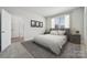 Bedroom with carpet, stylish furniture, natural light from the window, and neutral tones to create a serene atmosphere at 416 Balboa St, Matthews, NC 28104
