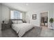 Serene bedroom with neutral tones, lots of natural light, and access to a walk-in closet at 416 Balboa St, Matthews, NC 28104