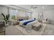 Bright primary bedroom features a sitting area, natural light from the windows, and elegant decor at 416 Balboa St, Matthews, NC 28104