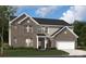 Inviting two-story home with a brick facade, attached garage, manicured lawn, and classic architectural details at 416 Balboa St, Matthews, NC 28104