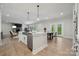 Open-concept kitchen with a central island, eat-in area, and seamless access to the Gathering room at 416 Balboa St, Matthews, NC 28104