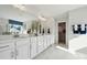 Elegant bathroom featuring double sinks, a large mirror, and a walk-in closet at 420 Balboa St, Matthews, NC 28104