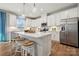 Modern kitchen featuring white cabinets, stainless steel appliances, and a large center island at 420 Balboa St, Matthews, NC 28104