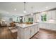 Open concept kitchen with an island that offers seamless transition into the dining and living area at 420 Balboa St, Matthews, NC 28104