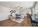 Open concept living room with ceiling fan, wood floors, and stylish decorations at 420 Balboa St, Matthews, NC 28104
