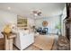 Cozy living area featuring a decorative accent wall, modern furnishings, and a stylish jute rug at 420 Balboa St, Matthews, NC 28104
