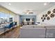 Relaxing living room featuring neutral color scheme, modern fixtures and plenty of light at 420 Balboa St, Matthews, NC 28104