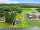 Aerial view of a home with a generous lot size, adjacent to a field and other community buildings at 522 Ne Connector Hwy, Albemarle, NC 28001