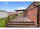 Wide view of deck shows wooden flooring, railings and the brick building to which it is connected at 522 Ne Connector Hwy, Albemarle, NC 28001