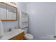 Clean and simple bathroom with vanity and toilet at 522 Ne Connector Hwy, Albemarle, NC 28001