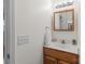 Close-up of a bathroom with a mirror, light fixture, and a sink on a vanity at 522 Ne Connector Hwy, Albemarle, NC 28001