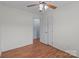 A simple bedroom with hardwood floors and neutral walls at 522 Ne Connector Hwy, Albemarle, NC 28001
