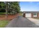 Brick home with long driveway bordered by trees at 522 Ne Connector Hwy, Albemarle, NC 28001