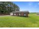 Lovely brick home with green lawn, mature trees, and a welcoming front porch at 522 Ne Connector Hwy, Albemarle, NC 28001