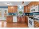 Kitchen with wood cabinets, granite countertops, stainless steel appliances, and a window at 522 Ne Connector Hwy, Albemarle, NC 28001