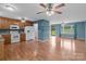 Bright, open-concept living room with hardwood floors connecting to a kitchen, great for entertaining at 522 Ne Connector Hwy, Albemarle, NC 28001